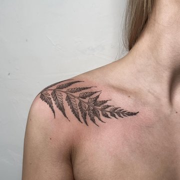 Marijuana leaf tattoo on the inner forearm.