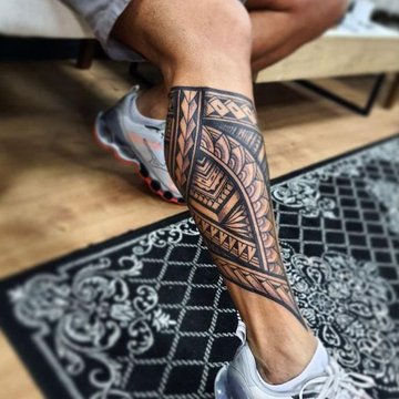 Simple tribal deals leg tattoo