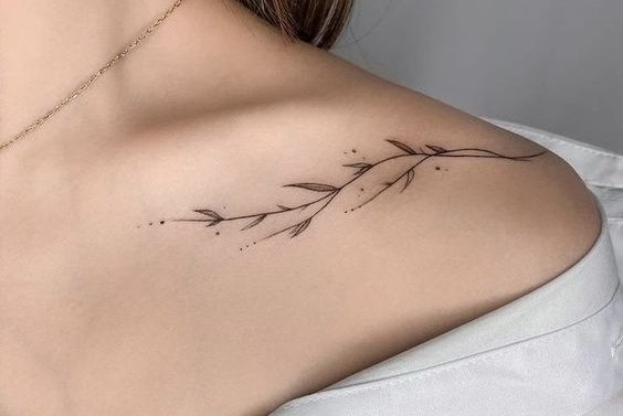 Wildflower tattoo on the left shoulder blade - Tattoogrid.net